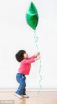 child releases balloon
